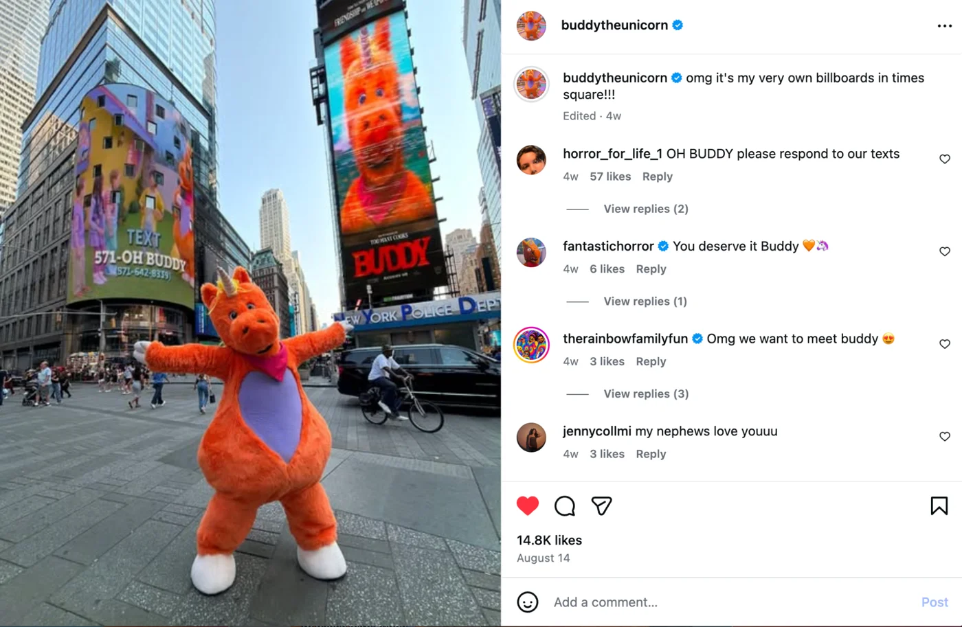 Buddy the Unicorn on a Times Square billboard with his phone number