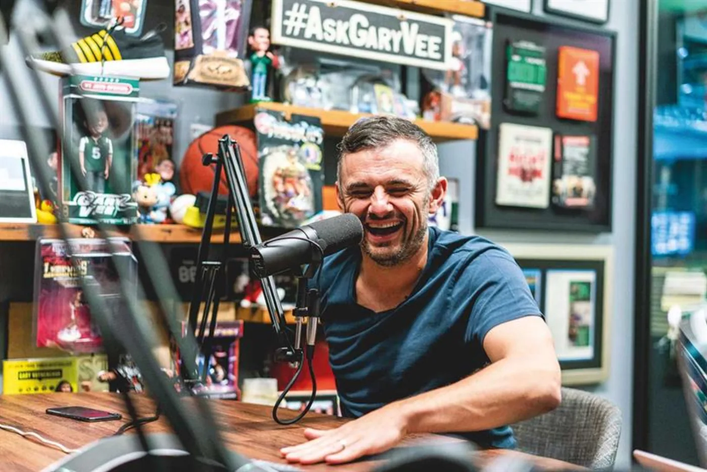 Gary Vee laughing at the #AskGaryVee podcast desk