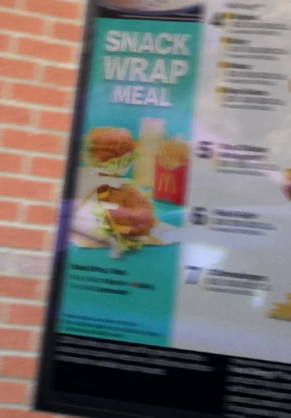 Snack wrap meal poster on a brick wall